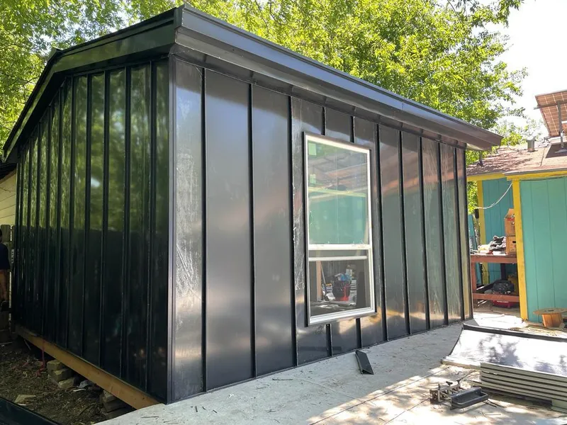 Black standing seam metal wall panels for Roof Inspection in Hays